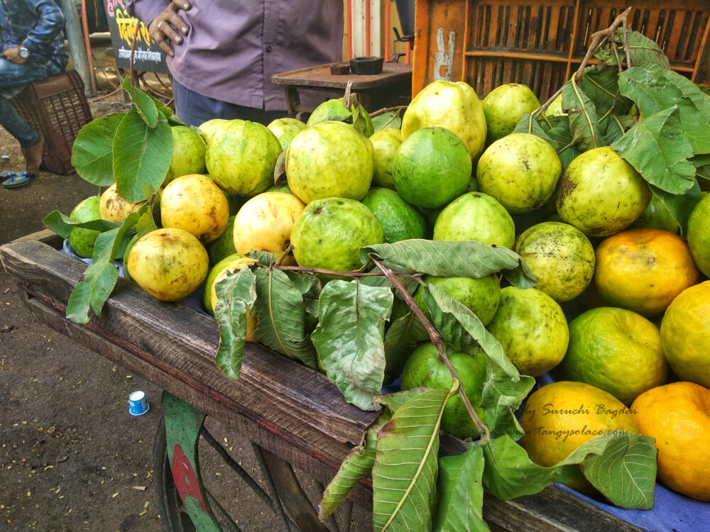 guavas and oranges on fruit cart roadside