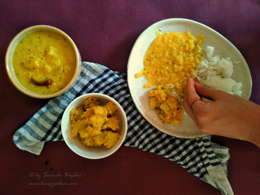 Tok dal ebam aloo poshto (Mango and lentils with poppy seeds potato curry)