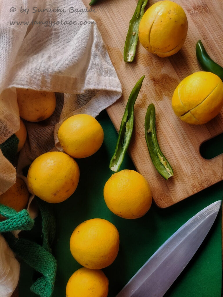 chopping board lemon bag and knife on green background