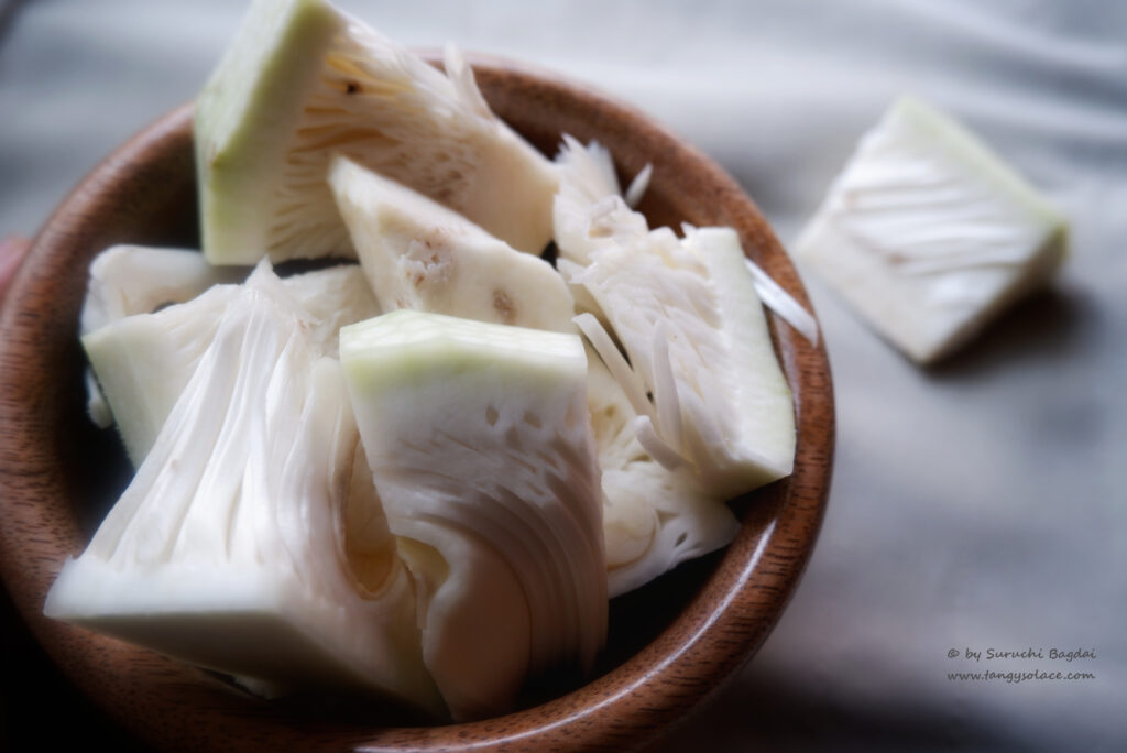 cut jackfruit in wood bowl on grey background