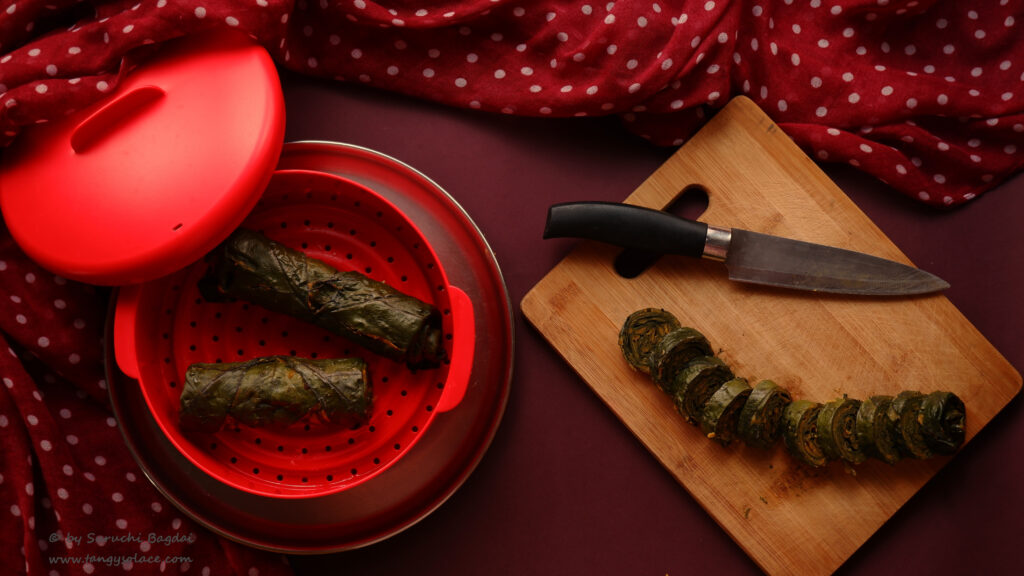 Steamed rolls and pinwheels of Colocasia leaves patra snack