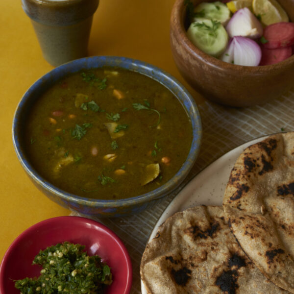 mirchiya dal, cut salad, chaas, thecha and bhakri