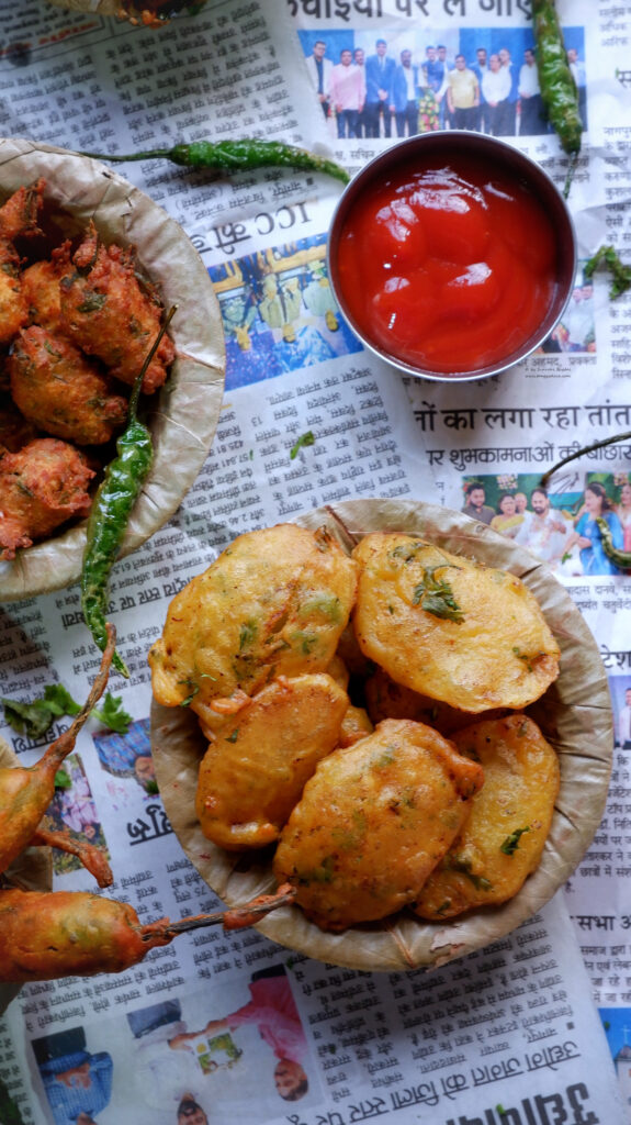 Aloo bhajiya served with ketchup and fried chillies 