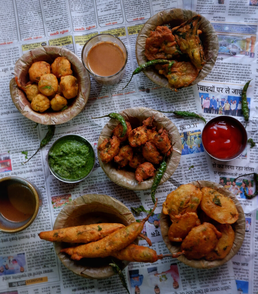 Assortment of bhajiyas served with tea, chutneys and fried chillies 