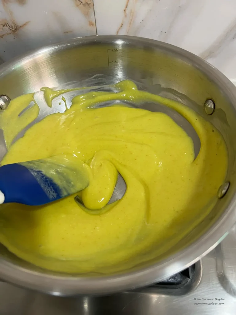 Undercooked khandvi batter in a pan